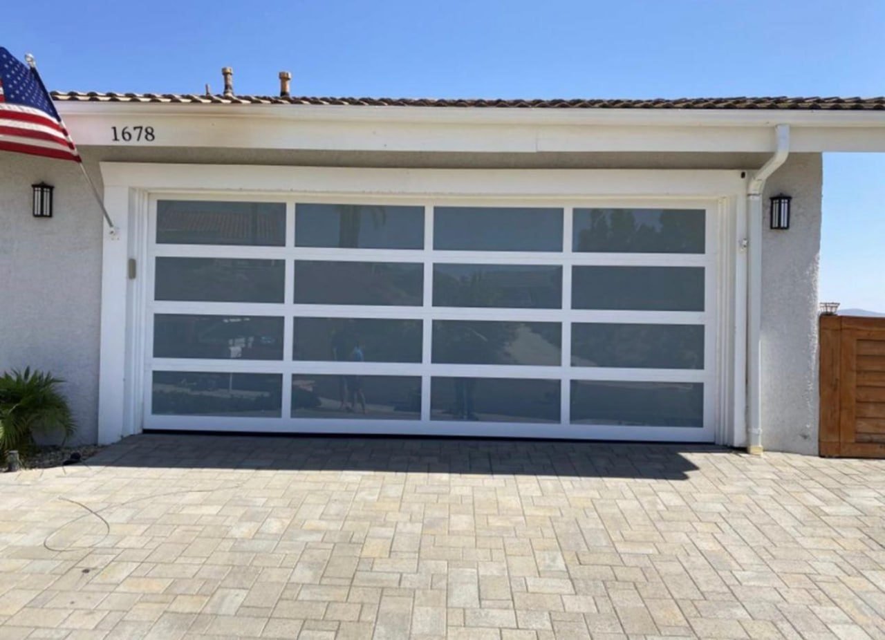 Modern full-view glass garage door installed by Pros Garage Doors Repair